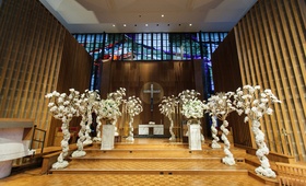 Ceremony Aisle Lined with Trees
Photography: Karlisch Photography %26 f8studio
Read More:
http://www.insideweddings.com/weddings/glamorous-new-years-eve-wedding-at-a-science-museum-in-dallas/960/ wedding ceremony space with aisle lined by trees covered in florals.