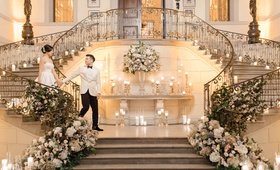 Couple at Oheka Castle Staircase
Photography: Lauren Fair Photography
Read More:
http://www.insideweddings.com/weddings/elegant-wedding-with-muted-regal-decor-at-oheka-castle-in-new-york/1243/ bride and groom walking down together grand staircase oheka castle flowers and candles on staircases