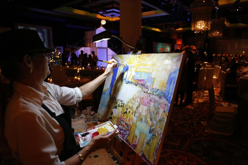 Painter
Photography: Tomas Ramos Photographers
Read More:
http://www.insideweddings.com/weddings/houston-indian-wedding-celebration-with-800-person-guest-list/435/ Wedding reception with a painter painting a the celebration as it was taking place