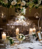 White Table Linen, Varying Florals, Glass Detailing
Photography: Eli Turner Studios
Read More:
http://www.insideweddings.com/weddings/ballroom-wedding-with-unique-garden-elements-in-washington-dc/819/ long table small and tall floral arrangements white flowers foliage hanging glass balls