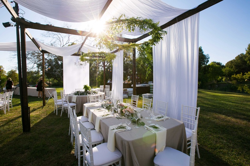 Champagne Tablescape with Suspended Green Wreath
Photography: Callaway Gable
Read More:
http://www.insideweddings.com/weddings/alfresco-summer-wedding-with-lush-foliage-accents-in-california/805/ rectangle champagne tablescape with low floral arrangement and wreath of foliage overhead