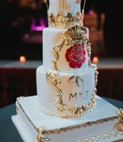 Magical Wedding Cake with Red Rose
Photography: Joel %26 Justyna
Read More:
http://www.insideweddings.com/weddings/dreamy-winter-destination-wedding-in-an-ice-castle-in-quebec-city/1270/ three layer wedding cake on white gold stand with hand painted flowers gold details crown