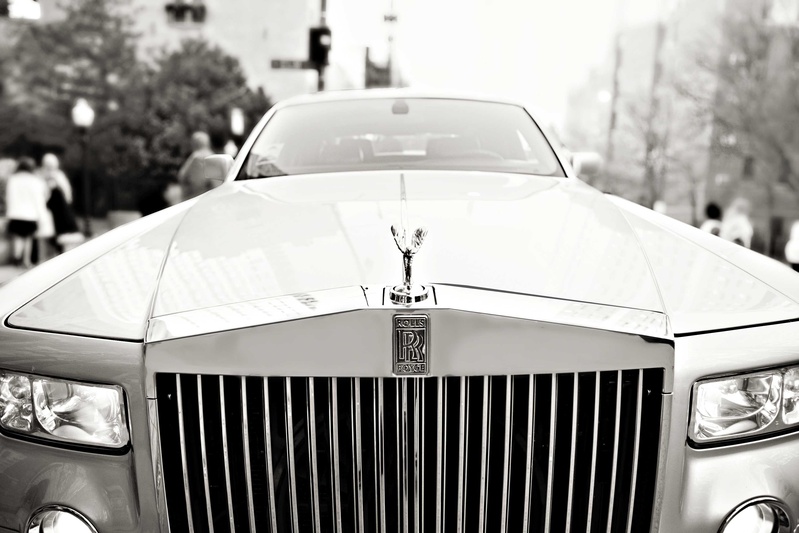 Rolls-Royce for Wedding Transportation
Photography: Carasco Photography
Read More:
http://www.insideweddings.com/weddings/church-ceremony-with-nigerian-traditions-chic-ballroom-reception/845/ Black and white photo of Rolls-Royce wedding car from wedding ceremony to reception location