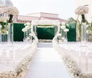 All-White Ceremony with Hedge Wall