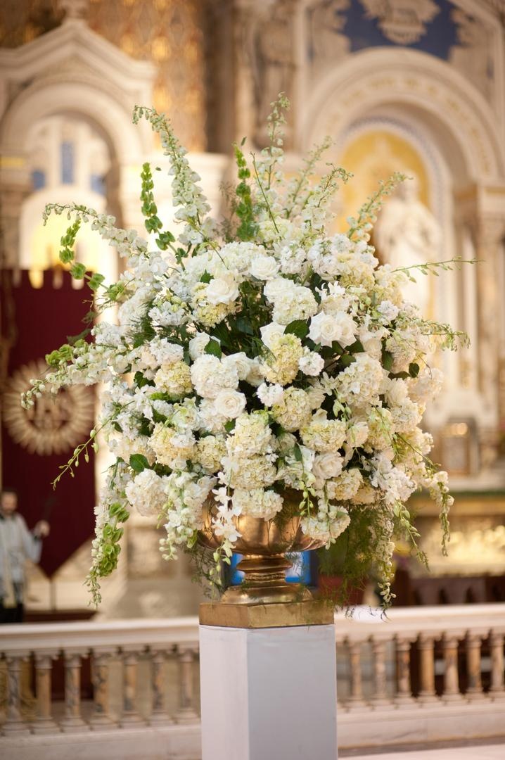 Ceremony Altar Arrangement
Photography: Justin Marantz
Read More:
http://www.insideweddings.com/weddings/unforgettable-miami-wedding-with-acrobats-tiger-cubs-fireworks/437/ White flowers in gold urn vase at Catholic ceremony
