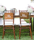 Wooden Mr. and Mrs. Signs on Chairs
Photography: Love and Water Photography
Read More:
http://www.insideweddings.com/weddings/destination-hawaiian-wedding-with-travel-vintage-theme-in-maui/772/ sweetheart table with wooden mr. and mrs. signs maui wedding