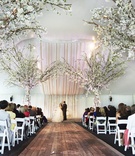 Tent Ceremony with Tree Decorations
Photography: KingenSmith
Read More:
http://www.insideweddings.com/weddings/luxurious-summer-tent-wedding-on-lake-michigan-in-chicago-illinois/671/ White tent wedding ceremony with wood aisle and tree decor
