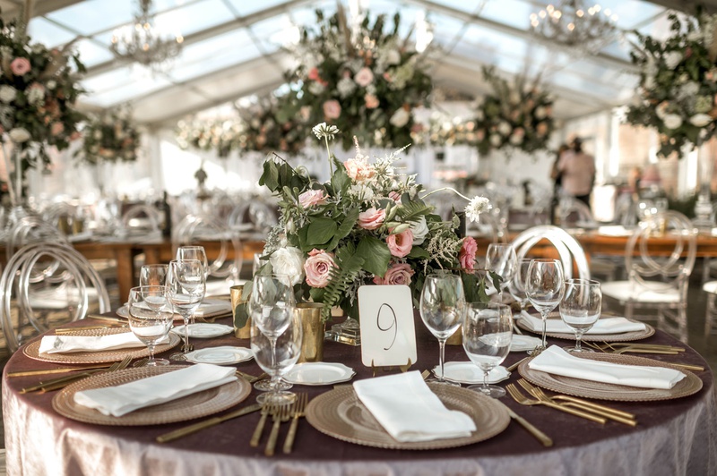Boho-Chic High %26 Low Centerpieces
Photography: Belle Ombre Photography
Read More:
http://www.insideweddings.com/weddings/vintage-bohemian-inspired-wedding-on-historic-bridge-in-cleveland/1373/ wedding reception clear tent round table and high low centerpieces chandeliers heatherlily