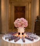 Pink Place Card Table Centerpiece
Photography: Chung Li Photography
Read More:
http://www.insideweddings.com/weddings/romantic-city-hall-wedding-with-korean-influences-in-san-francisco/707/ Wedding reception escort card table with ornate white urn, pink roses, hydrangeas