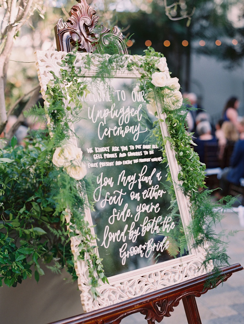 Unplugged Ceremony Mirror Sign
Photography: Mallory Dawn Photography
Read More:
http://www.insideweddings.com/weddings/outdoor-jewish-ceremony-luxe-reception-at-vibiana-in-downtown-la/1259/ wedding ceremony outdoor vibiana white frame mirror greenery unplugged ceremony calligraphy signage