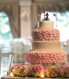 Playful Wedding Cake Topper with Flags
Photography: Brett Matthews Photography
Read More:
http://www.insideweddings.com/weddings/regal-outdoor-ceremony-ballroom-reception-at-oheka-castle-in-ny/821/ Pink rosette wedding cake decorations cartoon cake topper with flags and favorite things