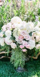 Pink Rose %26 White Hydrangea Flower Arrangement
Photography: Troy Grover Photographers
Read More:
http://www.insideweddings.com/weddings/a-romantic-alfresco-destination-wedding-with-a-soft-color-palette/717/ Ceremony flower arrangement in urn with pink rose, white hydrangea, and white dahlia flowers