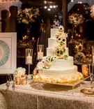 Wedding Cake with Ketubah
Photography: Laura Grier of Beautiful Day Photography
Read More:
http://www.insideweddings.com/weddings/romantic-timeless-garden-inspired-jewish-wedding-at-a-country-club/1292/ wedding cake buttercream frosting dahlia anemone rose flowers laser cut mr mrs cake topper candles