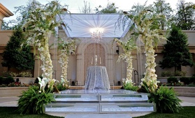Clear and Sparkling Altar
Photography: Unique Design Studios
Read More:
http://www.insideweddings.com/weddings/porsha-williams-and-kordell-stewart/371/ Alfresco ceremony canopy with floral-embellished pillars