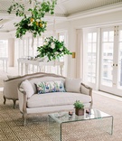 Settee with Clear Coffee Table
Photography: Branco Prata
Read More:
http://www.insideweddings.com/weddings/chic-destination-wedding-with-california-style-in-washington-dc/1042/ Wedding reception hanging flower arrangements from ceiling antique settee with watercolor pillow