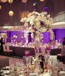 Purple %26 White Wedding
Photography: Dalal Photography
Read More:
http://www.insideweddings.com/weddings/glam-modern-wedding-with-purple-decor-in-los-angeles-california/342/ Reception centerpiece with crystal vase and floating candles