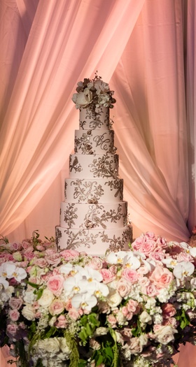 Six-Layer Blush Wedding Cake
Photography: Karlisch Photography
Read More:
http://www.insideweddings.com/weddings/luxury-hotel-wedding-with-personalized-elements-in-dallas-texas/1119/ Wedding cake on table with white orchid pink roses drapery blush cake with gold detailing frosting