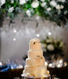 Four-Layer Cake with Fresh Blooms
Photography: Studio This Is
Read More:
http://www.insideweddings.com/weddings/traditional-catholic-ceremony-elegant-reception-in-chicago/1206/ wedding cake on silver stand buttercream stripes white pink rose flowers greenery