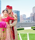 Bride and Groom in Front of New York Skyline
Photography: Alucinarte Films
Read More:
http://www.insideweddings.com/weddings/vibrant-indian-wedding-with-purple-details-in-new-york-city/815/ Indian-American couple in traditional wedding attire in front of New York skyline