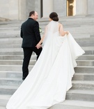 Bride and Groom Walk Up Steps
Photography: Erin Wilson Photography
Read More:
http://www.insideweddings.com/weddings/timeless-wedding-with-white-black-and-gold-palette-in-little-rock/993/ bride in justin alexander plain ball gown, holds train walks up steps with groom