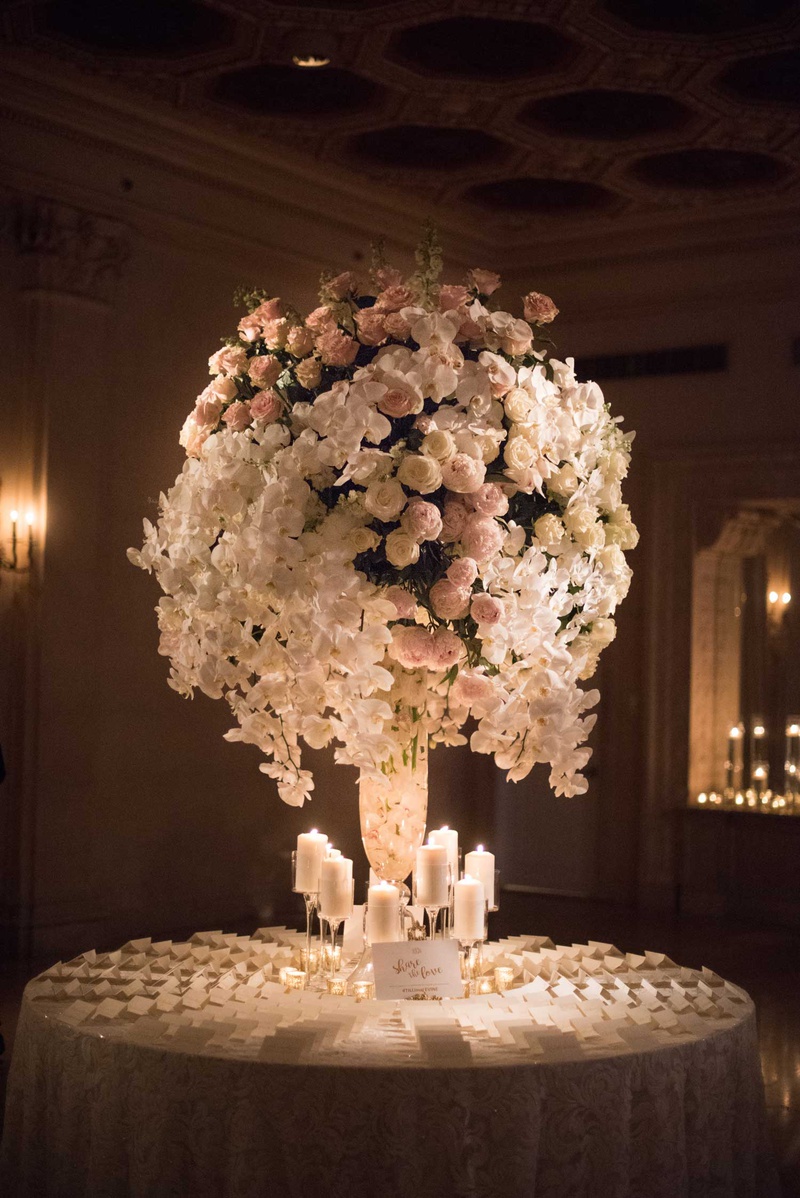 Escort Card Table with Candles %26 Flowers
Photography: The Day by Ira Lippke
Read More:
http://www.insideweddings.com/weddings/opulent-luxury-wedding-with-timeless-color-palette-in-new-york-city/1199/ wedding reception round table escort cards candles tall centerpiece pink peony white orchid