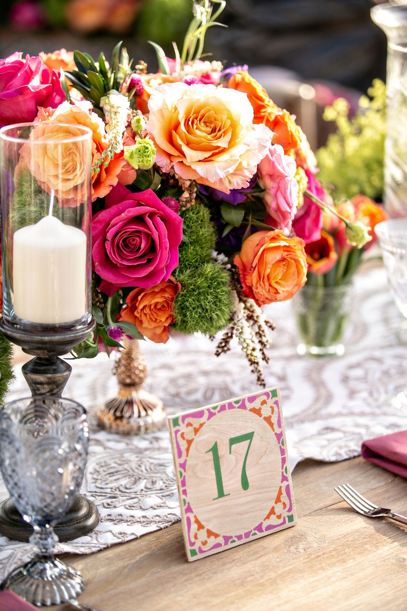 Colorful Wood Table Number
Photography: Laurie Bailey Photography
Read More:
http://www.insideweddings.com/weddings/outdoor-jewish-ceremony-reception-with-colorful-bohemian-decor/1330/ bohemian wedding reception wood table with table number pink orange green purple lace runner