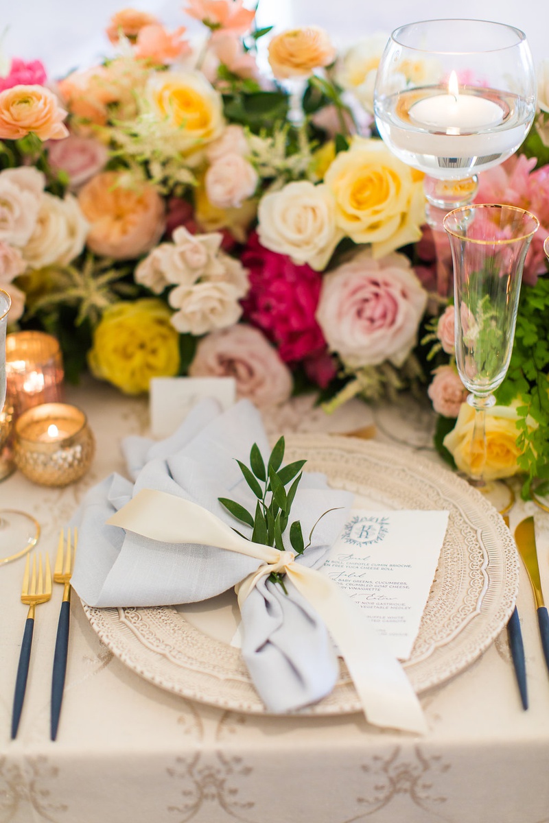 Elegant Place Setting with Blue Accents
Photography: Ashley Paige Photography
Read More:
http://www.insideweddings.com/weddings/romantic-ocean-view-ceremony-charming-reception-in-california/1337/ wedding guest place setting intricate charger plate with menu light blue napkin tied sprig of greens