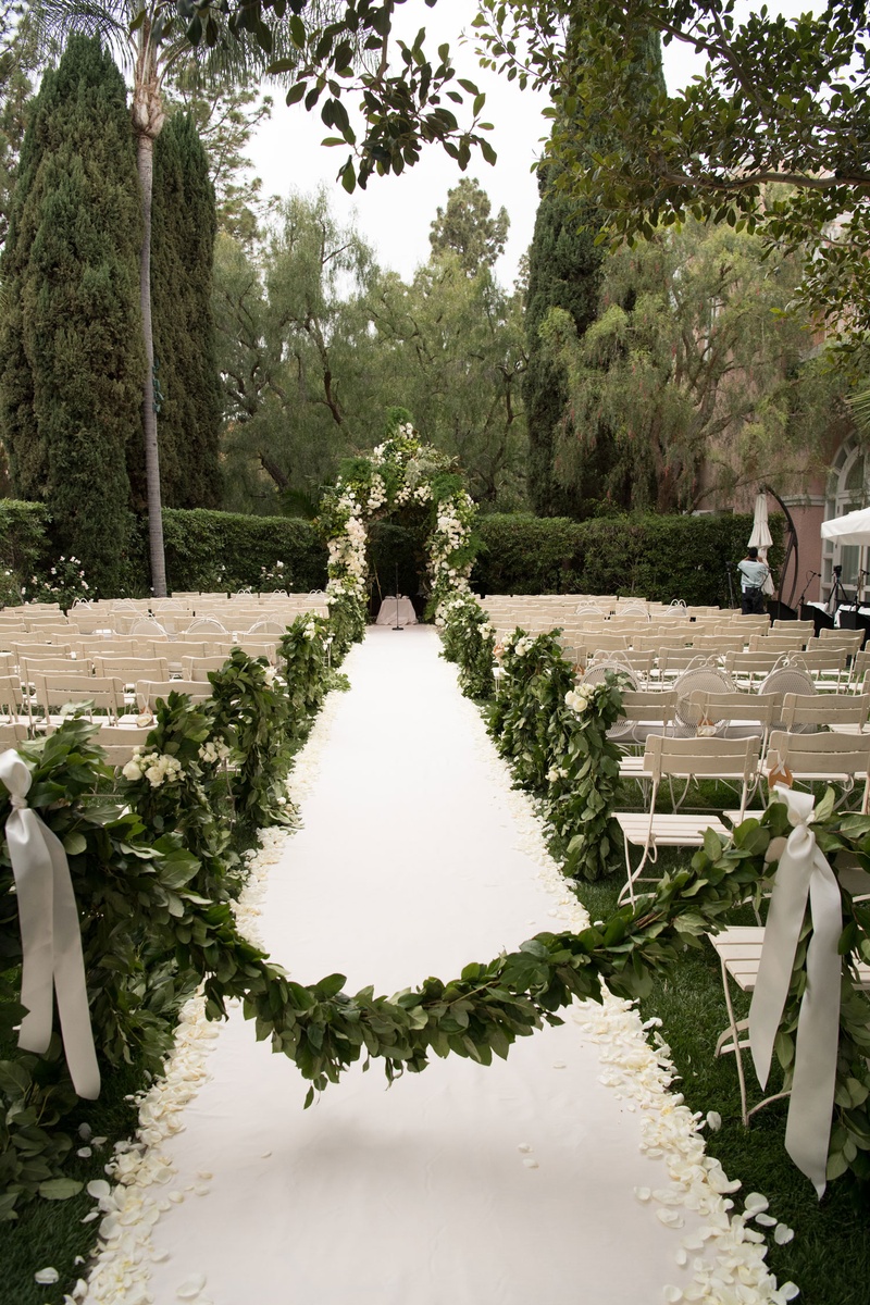 Green Garland at Ceremony Entrance
Photography: John Solano Photography
Read More:
http://www.insideweddings.com/weddings/an-opulent-garden-ceremony-ballroom-reception-in-beverly-hills/986/ White and green wedding outdoor garden motif beverly hills hotel stone aisle white aisle runner peta