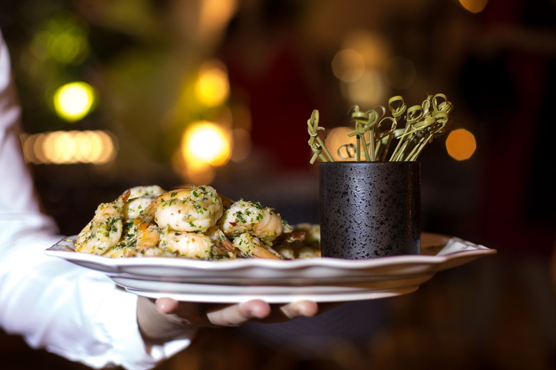 Tray-Passed Shrimp Hors d'Oeuvres
Photography: Maya Myers Photography
Read More:
http://www.insideweddings.com/weddings/candlelit-jewish-ceremony-unique-cozy-outdoor-reception-in-la/1346/ server holding platter of garlic herb shrimp on plate toothpicks wedding food ideas hors d'oeuvres