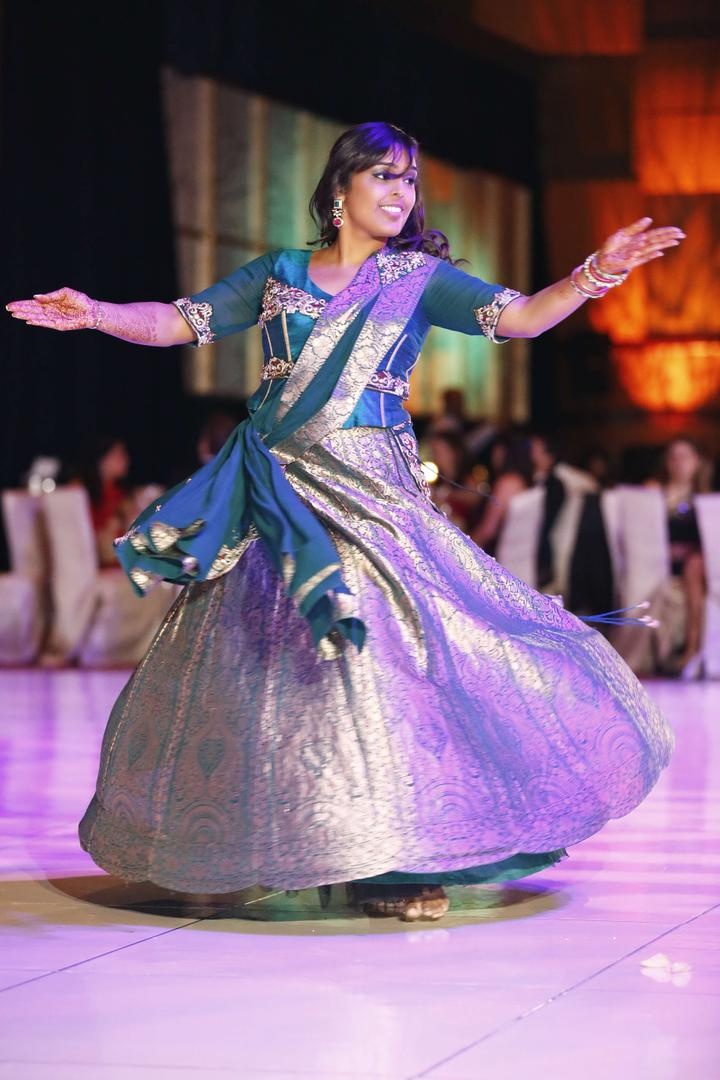 Bride Dancing at Reception
Photography: Tomas Ramos Photographers
Read More:
http://www.insideweddings.com/weddings/houston-indian-wedding-celebration-with-800-person-guest-list/435/ Indian bride dances at reception in a silver and blue lehenga