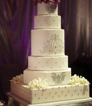 Crystal Wedding Cake
Photography: Dalal Photography
Read More:
http://www.insideweddings.com/weddings/glam-modern-wedding-with-purple-decor-in-los-angeles-california/342/ White wedding cake with silver details and rhinestones