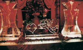Valentine's Day Ice Sculpture
Photography: Dalal Photography
Read More:
http://www.insideweddings.com/weddings/winter-wedding-at-the-jonathan-club-in-santa-monica-california/7/ Martini ice bar engraved with cupid shooting heart