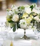Ivory Urn Centerpiece
Photography: lauren b. photography
Read More:
http://www.insideweddings.com/weddings/traditional-catholic-ceremony-romantic-tented-at-home-reception/664/ Silver mercury glass urn with white rose, white hydrangea