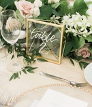 Gold Geometric Table Number
Photography: Lorely Meza Photography
Read More:
http://www.insideweddings.com/weddings/fall-outdoor-destination-wedding-at-luxe-resort-on-island-of-maui/1177/ Wedding reception table number modern calligraphy on wood table gold geo frame clear translucent