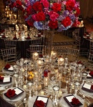 Bold Reception Tablescape
Photography: KingenSmith
Read More:
http://www.insideweddings.com/weddings/classic-chicago-wedding-with-mexican-ceremony-traditions/404/ Mirrored tabletop with Lucite chairs and bright centerpiece