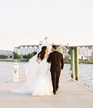 Couple on Pier
Photography: Adam Barnes
Read More:
http://www.insideweddings.com/weddings/rustic-inspired-waterfront-wedding-in-small-town-maryland/592/ Bride and groom walking on plank in wedding attire