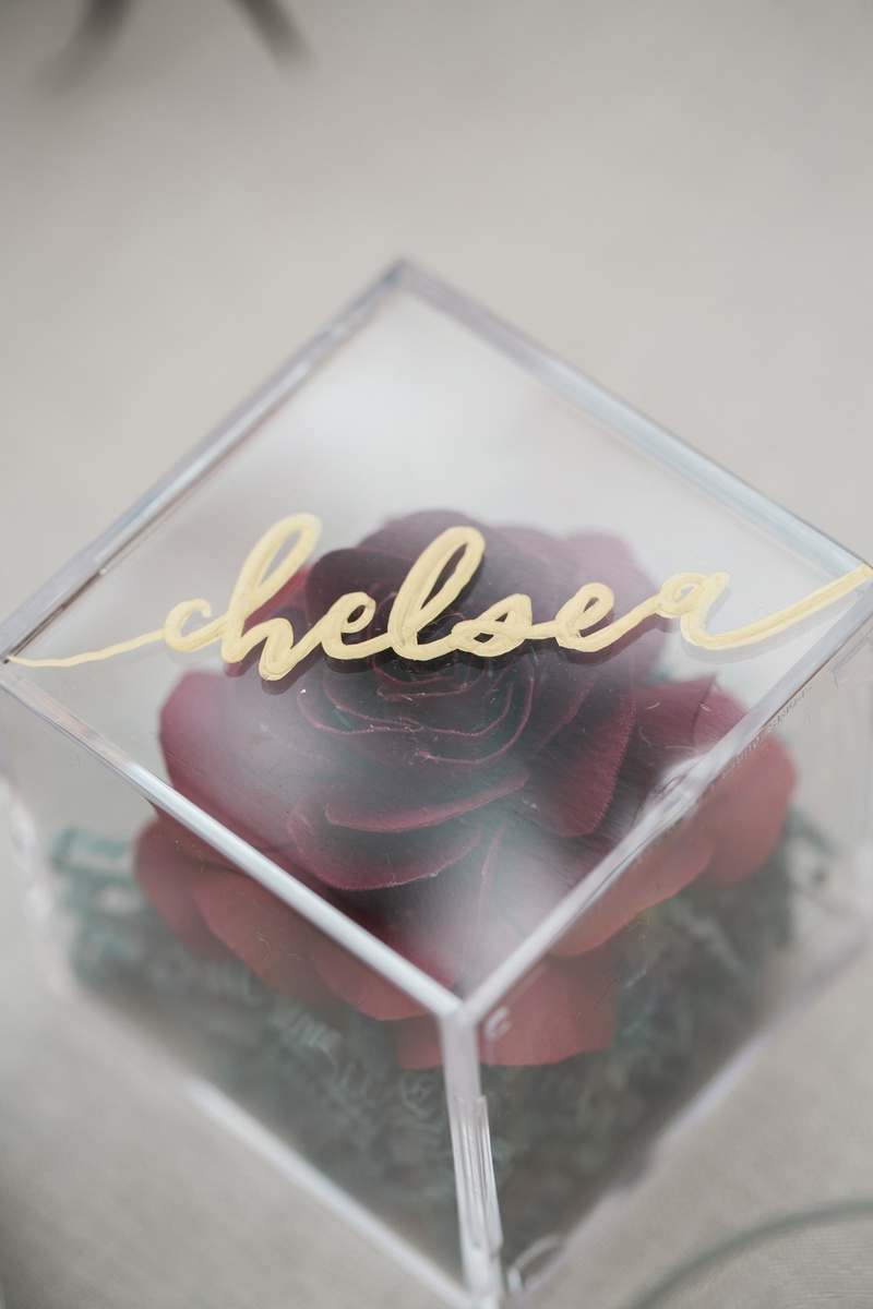 Paper Rose in Acrylic Box
Photography: Jessica Claire Photography
Read More:
http://www.insideweddings.com/weddings/unique-chic-bridal-shower-with-dark-and-moody-color-scheme/1335/ place card and bridal shower favor with paper rose inside of acrylic box with gold calligraphy