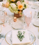 Fresh Greenery on Alfresco Place Setting
Photography: Ashley Paige Photography
Read More:
http://www.insideweddings.com/weddings/elegant-outdoor-fall-wedding-at-a-rustic-chic-venue-in-malibu/1244/ wedding reception gold bead charger plate pink glassware goblet orange pink flowers greenery