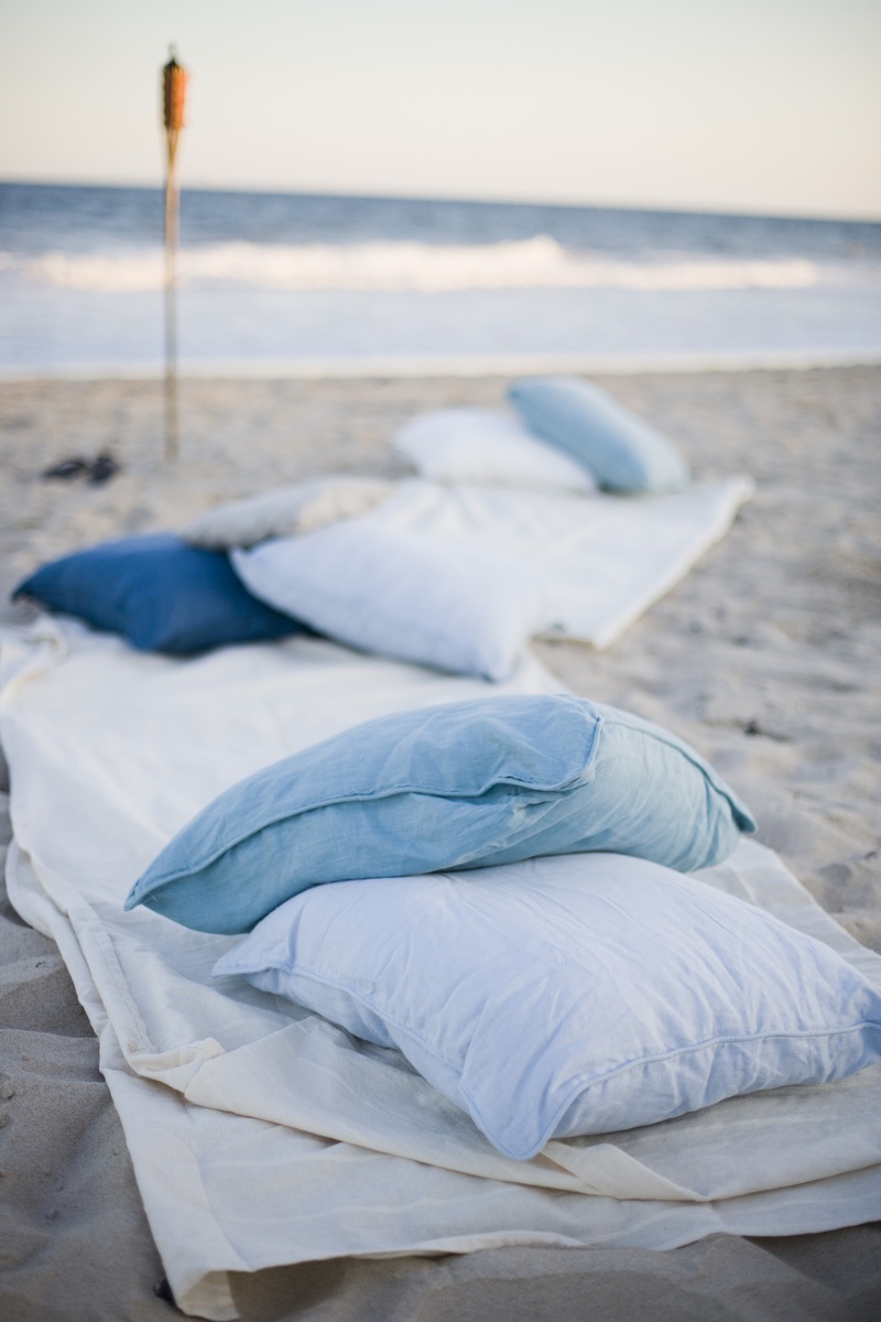 Rehearsal Dinners Photos Pillows And Blankets On Beach Inside