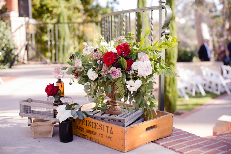 Flower Arrangement with Wine Box
Photography: Acqua Photo
Read More:
http://www.insideweddings.com/weddings/balboa-park-wedding-with-wine-inspired-color-scheme-in-san-diego/948/ arrangement of red, white, and lavender roses displayed with wine box