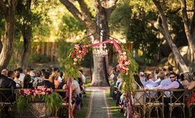 Aisle Arch with Bright Flowers %26 Ribbons
Photography: Amanda McKinnon Photography
Read More:
http://www.insideweddings.com/weddings/bride-wears-claire-pettibone-gown-to-bohemian-outdoor-wedding/668/ Outdoor bohemian wedding ceremony in tree grove with metal arch, peach, fuchsia red flowers, ribbons