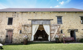Oldest Barn in Iowa Wedding Venue
Photography: Mark Steines
Read More:
http://www.insideweddings.com/weddings/western-wedding-with-rustic-decor-at-the-oldest-barn-in-iowa/705/ Gehlen Barn wedding venue in Iowa with flowers and drapery