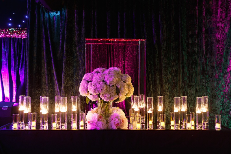 Candles %26 Blossoms at Dance Tent
Photography: Karlisch Studio
Read More:
http://www.insideweddings.com/weddings/southern-chic-wedding-in-oklahoma-with-performance-by-boyz-ii-men/697/ Wedding reception tent with mirror-top table, floating, votive candles, white hydrangeas, roses
