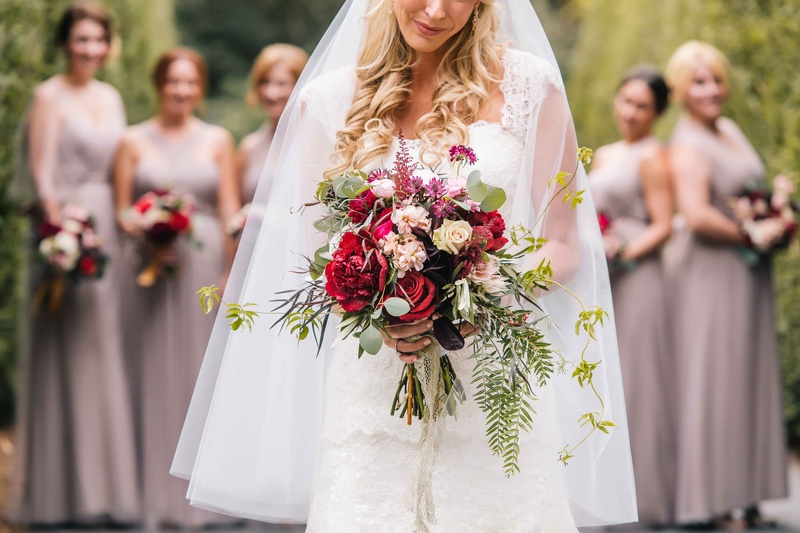 Bride and Bridesmaids Display Wine-Colored Bouquets
Photography: Vue Photography
Read More:
http://www.insideweddings.com/weddings/baroque-autumn-wedding-with-deep-wine-tones-in-north-carolina/770/ bride displays her autumn bouquet featuring wine colored florals with bridesmaids in background