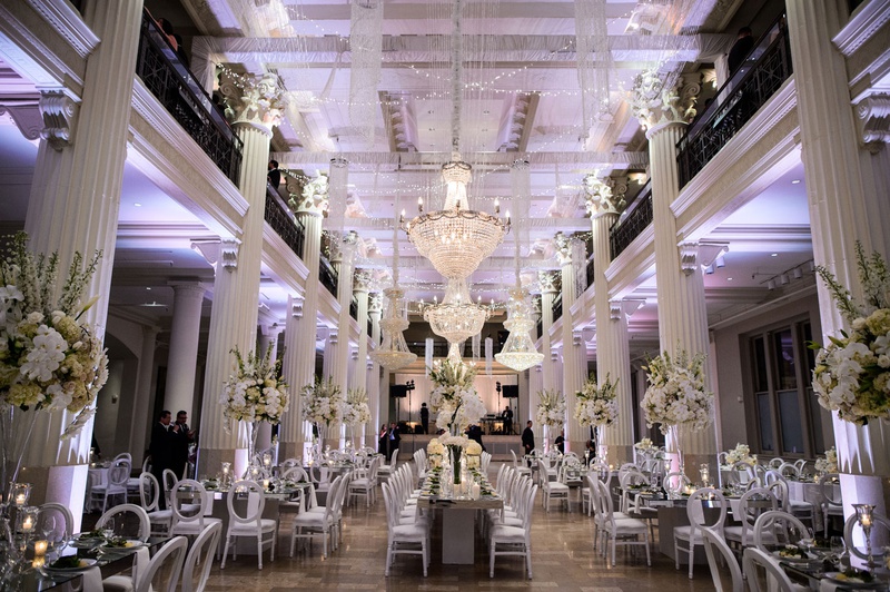 Gorgeous Ballroom Reception with Chandeliers
Photography: Chris Bailey Photography
Read More:
http://www.insideweddings.com/weddings/modern-elegant-ballroom-wedding-with-white-flowers-in-houston/1246/ wedding reception at the corinthian in houston white columns purple lighting white flowers modern
