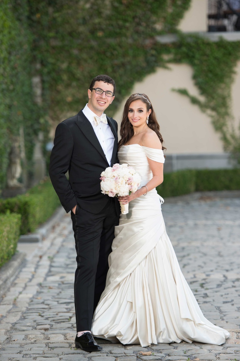 Helene Weiss %26 Samuel Kyle Mersky
Photography: Brett Matthews Photography
Read More:
http://www.insideweddings.com/weddings/regal-outdoor-ceremony-ballroom-reception-at-oheka-castle-in-ny/821/ Bride in off the shoulder Pnina Tornai wedding dress and groom in tuxedo with white bow tie glasses