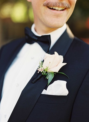 White Garden Rose Boutonniere magical garden ceremony + tented reception with chic french theme White Garden Rose Boutonniere magical garden ceremony + tented reception with chic french theme