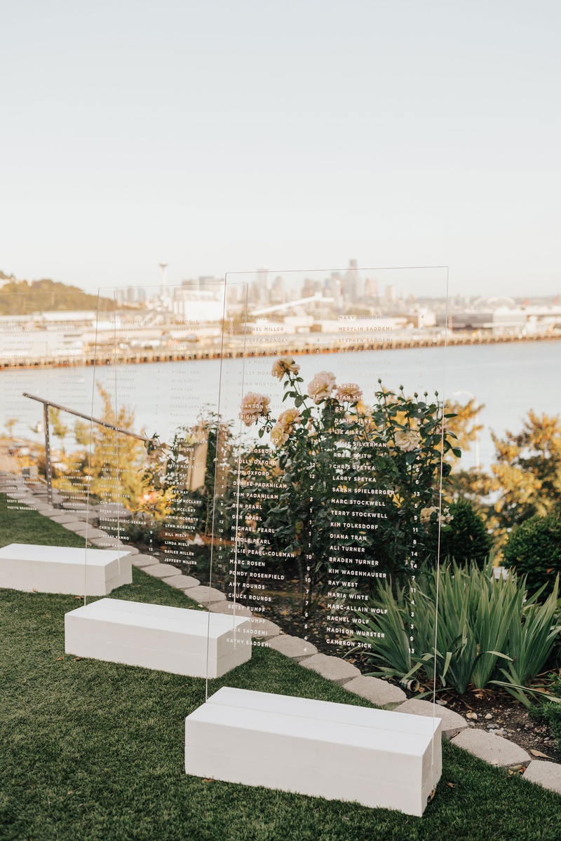 Clear Acrylic Seating Charts with Views
Photography: Sam %26 Sola Lee Photography
Read More:
http://www.insideweddings.com/weddings/modern-outdoor-ceremony-tent-reception-in-seattle-on-puget-sound/1309/ acrylic lucite seating chart for wedding in front of view puget sound seattle skyline