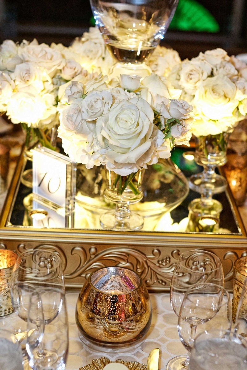 Mirrored Stand with White Flowers and Table Number
Photography: KingenSmith
Read More:
http://www.insideweddings.com/weddings/delicately-detailed-chicago-wedding-with-jewish-christian-customs/762/ white flowers mirrored stand with gold detailing and glass table number small candle