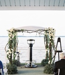 Chuppah at End of Pier
Photography: Adam Barnes
Read More:
http://www.insideweddings.com/weddings/rustic-inspired-waterfront-wedding-in-small-town-maryland/592/ Branches adorned with greenery and flowers